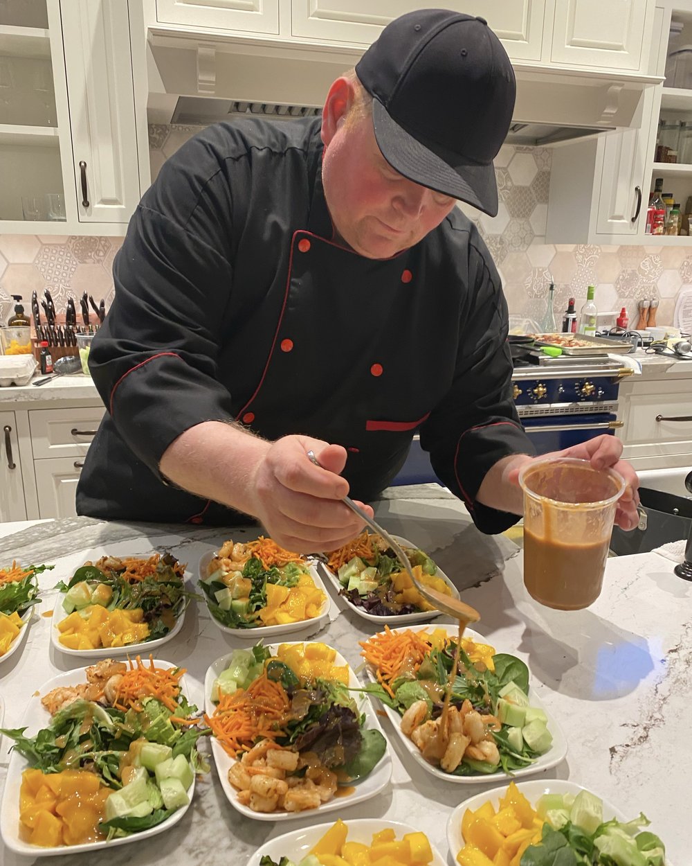Chef David plating food in the kitchen